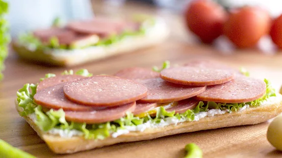 Delicious Salami Fall On Sandwich Bread.